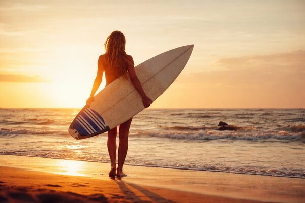 Surfer at sunset in Weligama